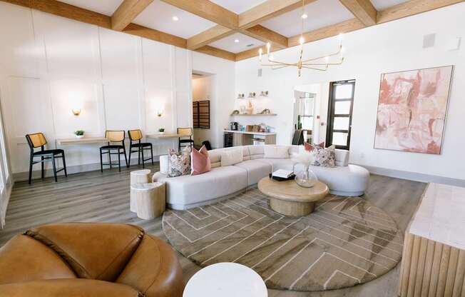A living room with a brown leather chair and a white coffee table.