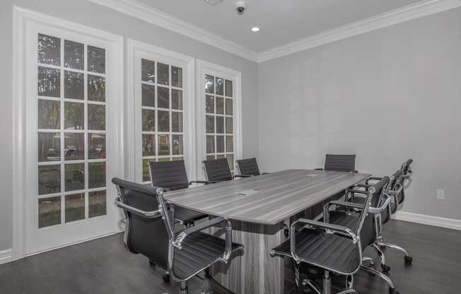 a room filled with rows of chairs in front of windows