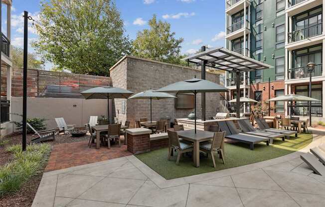 A patio with a table and chairs under a canopy.