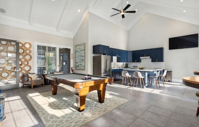Clubhouse Pool Table and Kitchen at Caribbean Breeze Apartments in Tampa, FL.