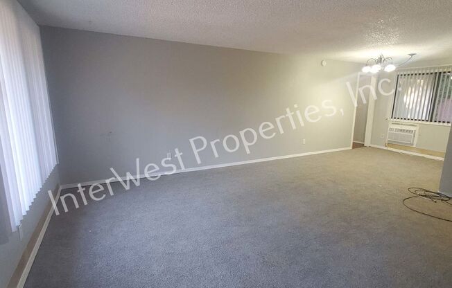 Beautiful Ranch Style Home on Very Large Corner Lot With W/D Hookups, Fireplace, 2 Car Garage & A/C Unit!