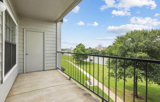 A2 floor plan balcony overlooking Hackberry Creek at Jefferson Creek Apartments in Irving, TX.