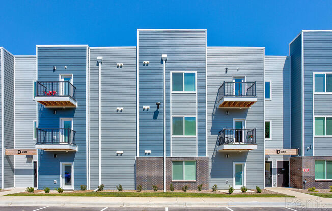Apartment building with balconies and doorsat Lofts at Fox Ridge, Missouri