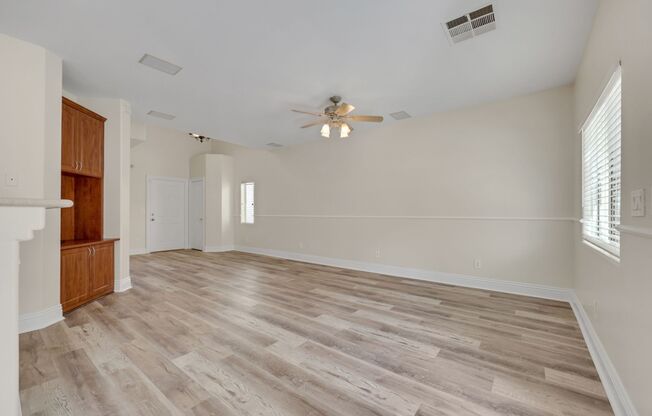 Gorgeous home with new flooring throughout and a Community Pool!