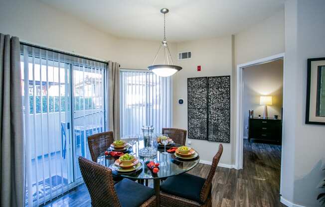 Spacious Apartment Dining Area with Table and Sliding Glass Doors