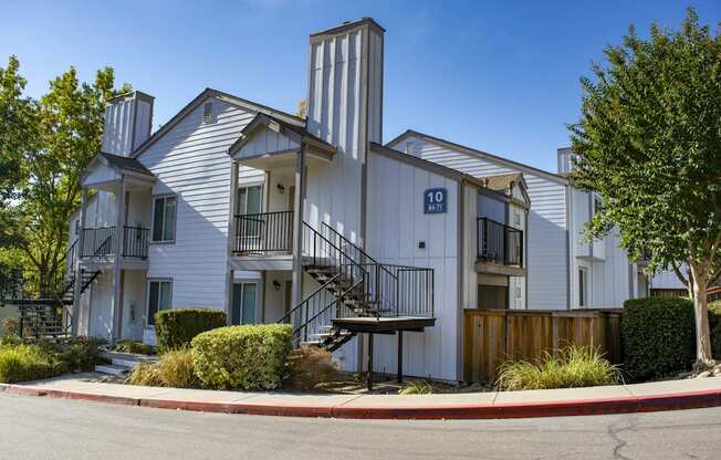 Street view of exterior building, showing off private patio/ balcony