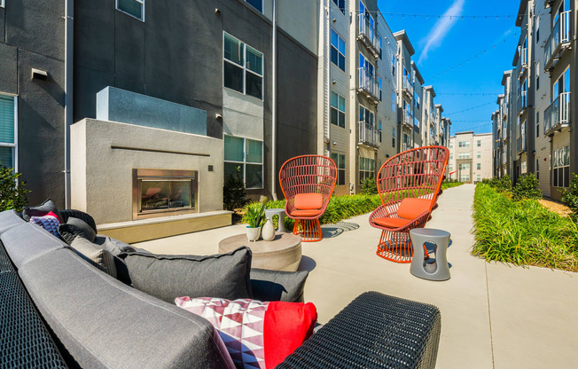 a patio with chairs and a fire pit at Mockingbird Flats, Dallas, 75206