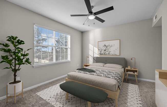 a bedroom with a bed and a ceiling fan