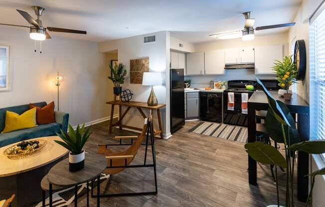 a living room and kitchen in a two bedroom apartment