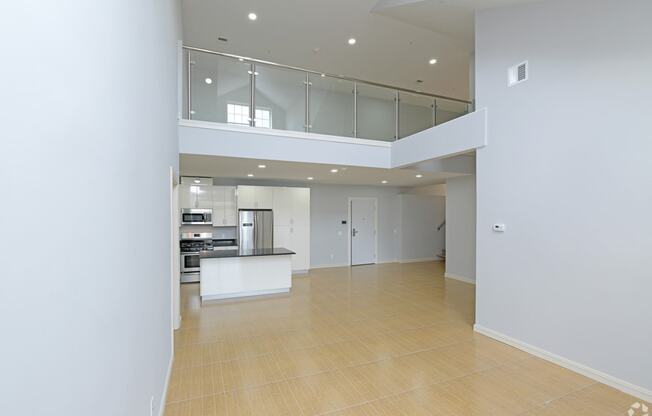 new apartment in stoughton living room area looking back at kitchen and loft
