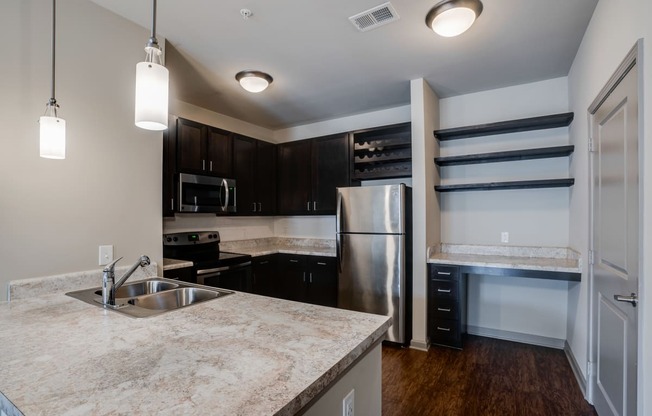 Kitchen with Espresso Cabinetry and Built-In Wine Rack