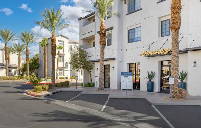 Tall, graceful palm trees line the pathway, adding a touch of tropical elegance to the space.