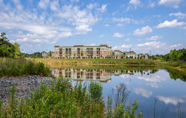 a view of a lake with a building in the background