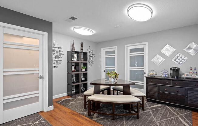 a dining room with a table and chairs