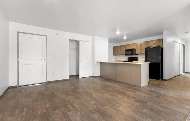 A kitchen area with a counter and cabinets.