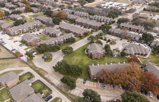 An aerial view of a neighborhood of houses in a suburb