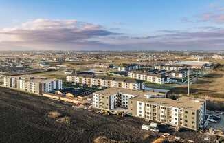 an aerial view of a city with new apartment buildings