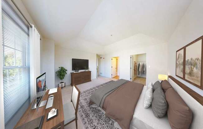 A bedroom with a bed, desk, and chair.