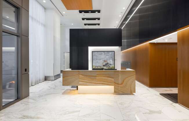 a reception desk in a lobby of a building