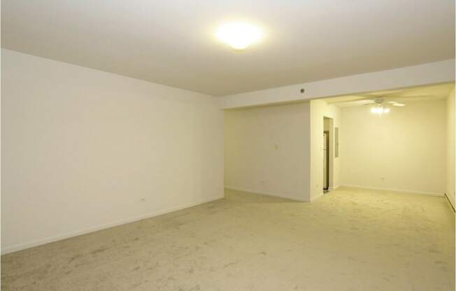Carpeted Living Room at Lansing Riverwood, LLC, Lansing, IL, 60438