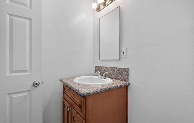 a bathroom with a sink and a mirror