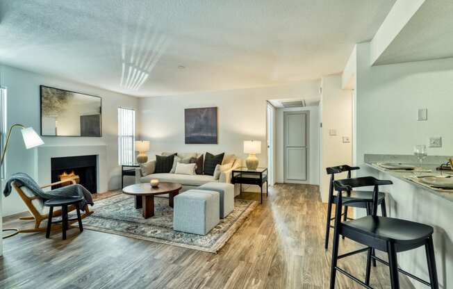 a living room with a couch and a table and a fireplace