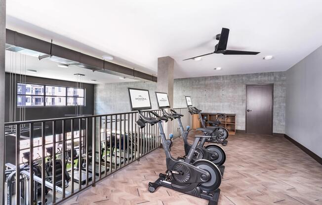 The two-story fitness studio features premium cardio equipment, dedicated training areas, and ample space to support every workout routine.