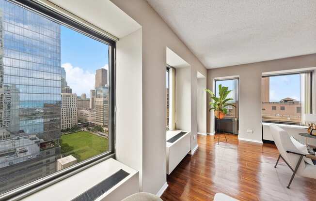 a living room with a large window and a view of the city