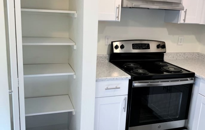 Kitchen with Stainless Steel Appliances - Apartments in Steilacoom