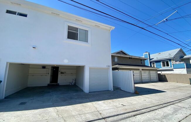 BLOCKS from the BEACH and Bay! Spacious 3 Bedroom in PB! Garage Storage! On Site Laundry!