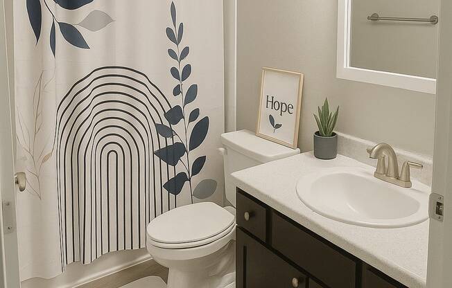 A bathroom with a toilet, sink, and shower curtain.