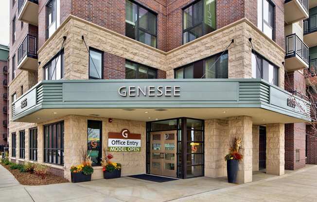 outside of entrance to apartment, with sign that says "Genesee"