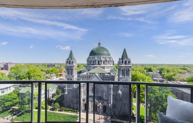 a balcony with a view of a large building