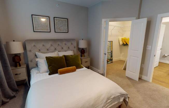 a bedroom with a large bed and a closet at The Fitzroy San Marcos, San Marcos, Texas