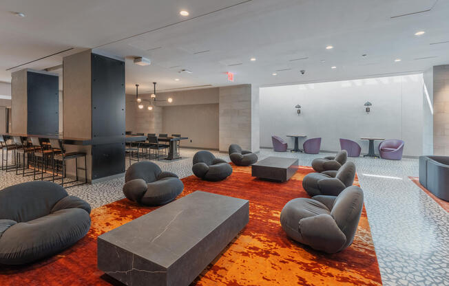 595 Dean St Apartment's Homework space with comfy seating and brightly colored rug 