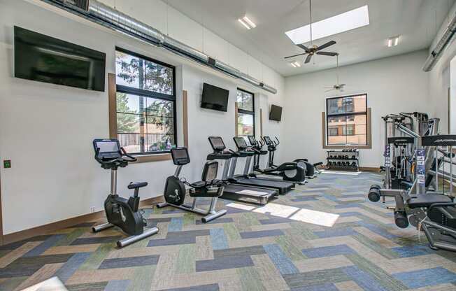 fitness center with cardio and weight equipjment