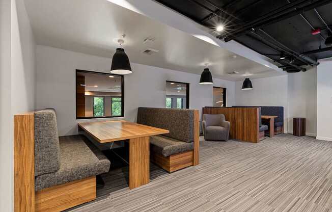 A conference room with a long table and chairs.