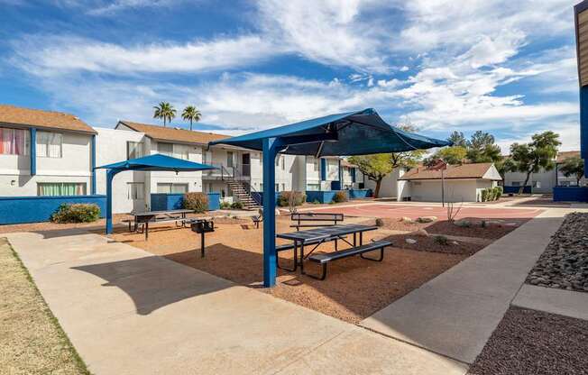 Pet-Friendly Apartments In Tucson, AZ – Midtown on Seneca - Photo of Courtyard with Picnic Tables