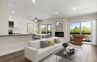 A modern living room with a white couch and a black coffee table.
