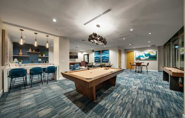 play a game of pool in our game room at our apartments