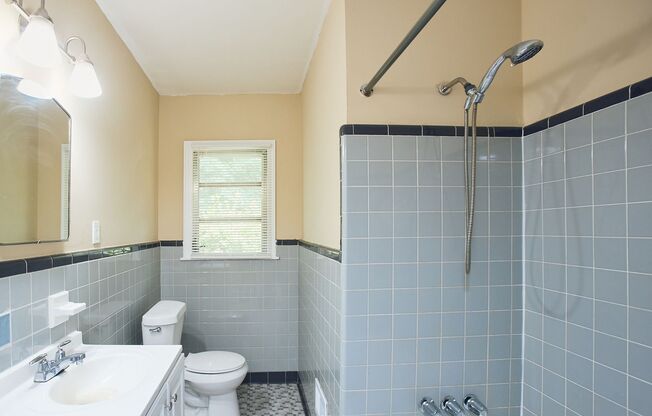 Vintage Charm with Modern Upgrades and Sunroom Living