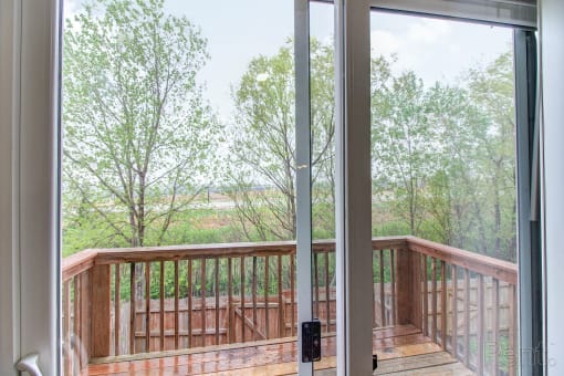 a view of the deck from a large sliding glass door