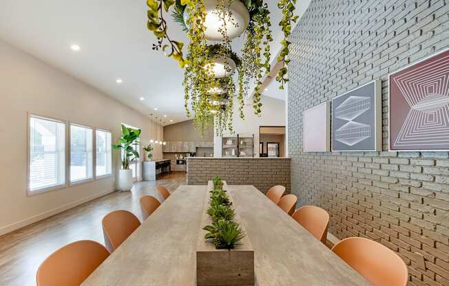 a dining room with a long table and chairs at Paisley and Pointe Apartments, Nevada, 89130