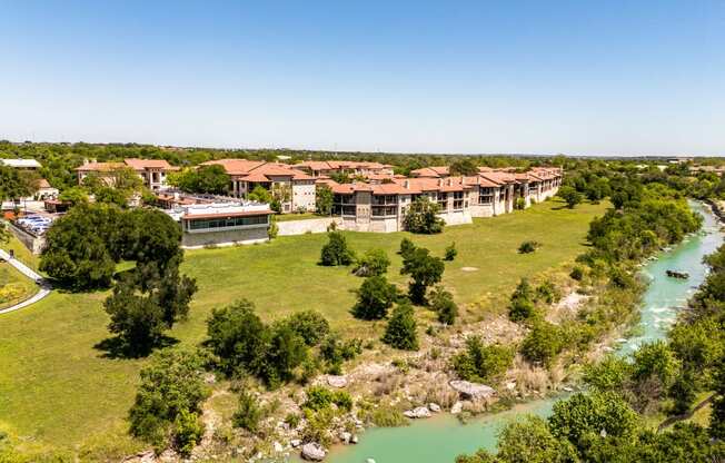 an aerial view of the resort and river