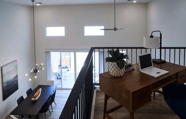 a living room with a desk with a laptop on it at Novella Biltmore, Phoenix Arizona