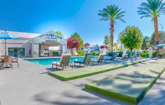 Shuffleboard poolside at Country Club at The Meadows Senior Apartments in Las Vegas, NV, For Rent. Now leasing 1 and 2 bedroom apartments.