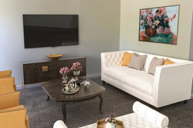 a living room with white furniture and a television