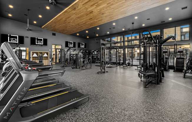 A gym with treadmills and other exercise equipment.