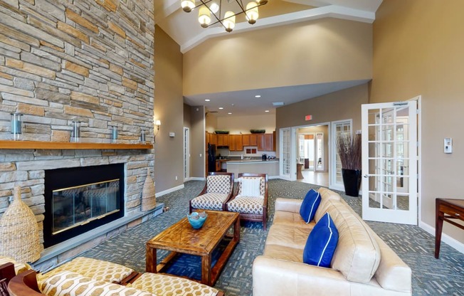 Boston road clubhouse lounge with fireplace and kitchen