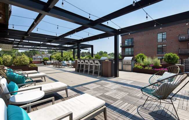 a large patio with tables and chairs and a bar